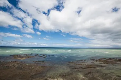 a view of the ocean under a cloudy sky at Loddey's Self Catering Apartments - by Beach Collection in Strand