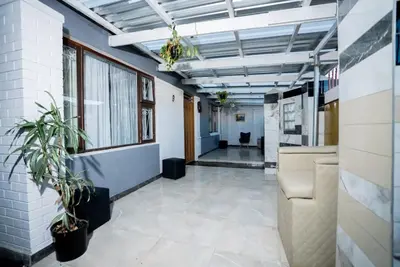 an office space with a hallway with plants at Boblodge in Cape Town