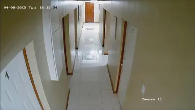 an empty hallway with doors and a tile floor at Spring forth guest house in De Grendel