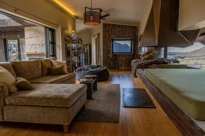 a large living room with a couch at Skaam Cabin Luxe Hideaway with a Naughty Side in Wolseley