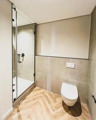 a bathroom with a toilet and a shower at Bethany Apartment ON PARK Century City in Cape Town