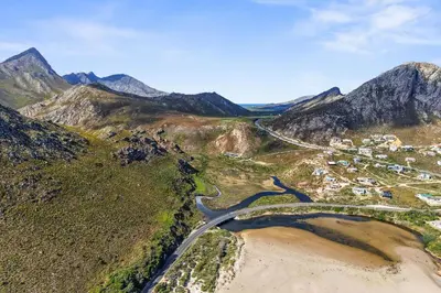 an aerial view of a road in the mountains at Red River Valley in Rooiels