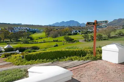 a sign for a golf course with a view at Winelands Golf Lodges 5 in Stellenbosch