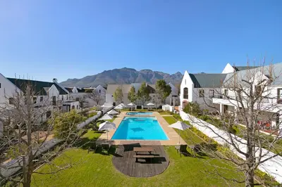 an aerial view of a house with a swimming pool at Winelands Golf Lodges 5 in Stellenbosch