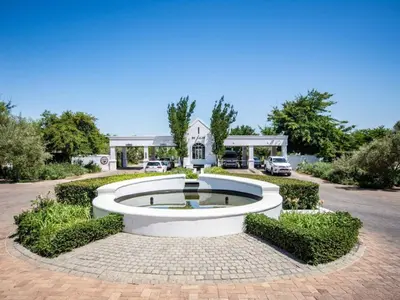 a fountain in the middle of a parking lot at Winelands Golf Lodges 8 in Stellenbosch
