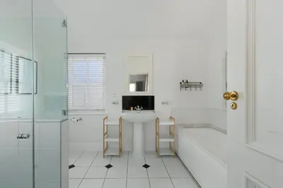 a bathroom with a sink and a tub and a toilet at Winelands Golf Lodges 40 in Stellenbosch