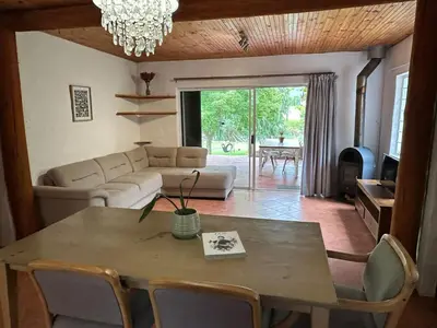 a living room with a table and a couch at Nature Lover's Home in Grabouw in Grabouw