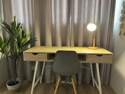 a desk with a lamp and a chair in a room at Serene waterfront escape! Luxury, King bed! in Durbanville