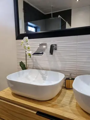 a bathroom with a large white sink on a wooden counter at Scenic Mountain & Winelands views, Modern Design in Tygerberg Hills