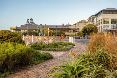 a brick road in front of a building at Hermanus Waterfront Boho Studio Apartment, Whale Coast Hideaway in Hermanus