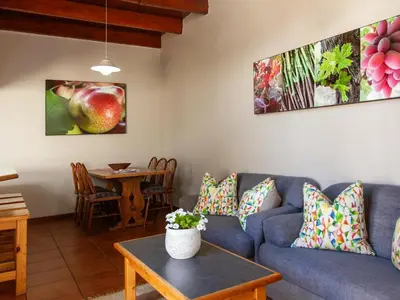 a living room with a blue couch and a table at The Habit Apartments in Worcester