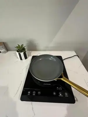 a frying pan sitting on top of a stove at Best Rest Somerset 3 in Somerset West