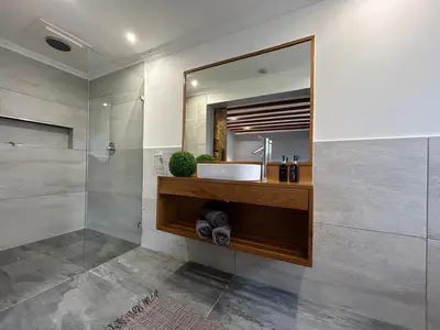 a bathroom with a sink and a mirror at Val Mor country house in Paarl