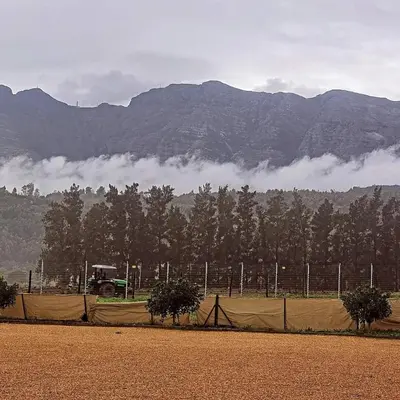 a fence with a truck in front of a mountain at Val Mor country house in Paarl