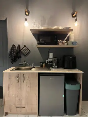 a kitchen with a sink and a counter top at Southern Comfort Guest House in Bellville