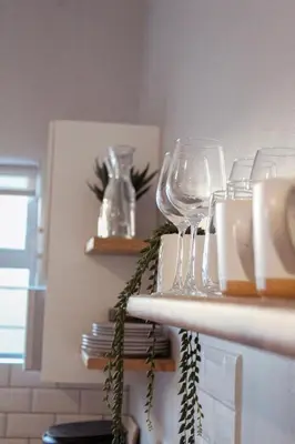 a group of wine glasses sitting on a counter at Sage And Vine Studio in Worcester