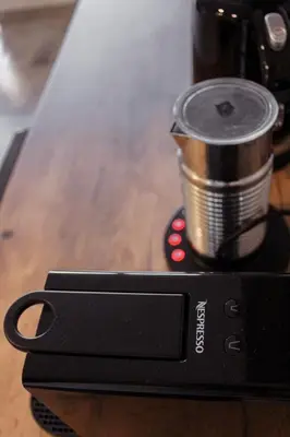 a coffee maker with a cup on top of a table at Sage And Vine Studio in Worcester