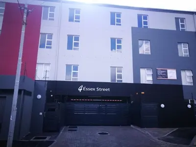 a building with aessen street sign in front of it at 4 Essex Street Apartment in Cape Town