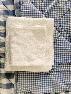 a white napkin sitting on top of a blanket at Dottie's charming cottage two bedroom apartment and workspace in Paarl