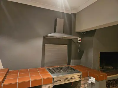 a kitchen with a laptop sitting on a counter at Cape Golf Villa in Cape Town