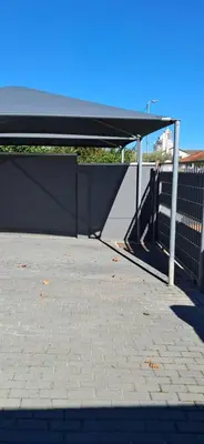 awning over a walkway with a brick sidewalk at Strand Overnight - 24 Hour check-in - close to major private hospitals - sleeps 1- 4 guests - self catering - quiet neighborhood - week night low rate for single guest - weekends min 2 nights in Strand
