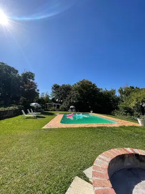 a swimming pool in the middle of a yard at Rose Cottage, Elgin Grabouw in Grabouw