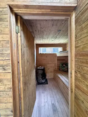 a wooden sauna with a wooden floor and a window at Rose Cottage, Elgin Grabouw in Grabouw