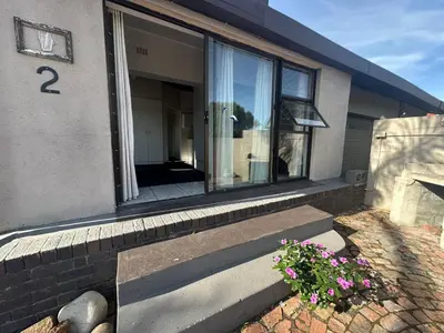 a house with the number on the side of it at Suite Dreams Spacious Apartment in Panorama