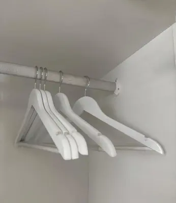 a group of white hangers hanging from a ceiling at Little Haven in Kenridge