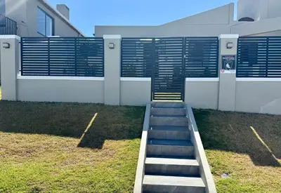 a set of stairs in front of a building at Courtyard Hideaway in Kenridge