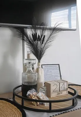 a tray with a vase and a box on a table at SeeHUYS Boutique Bloubergstrand Beachfront Studio in Bloubergstrand