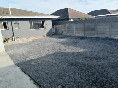 a yard in front of a house with a fence at 72 the trout H lodge in Goodwood