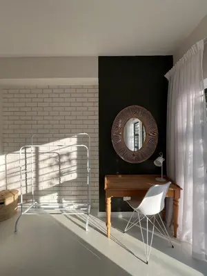 a room with a desk and a mirror and a chair at Bosch & Bloom in Stellenbosch
