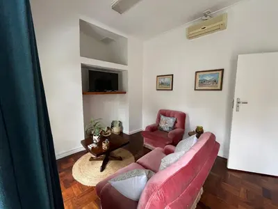 a living room with two couches and a tv at Central Somerset Stay in Somerset West
