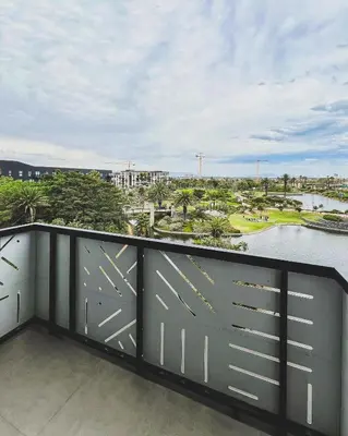 a balcony with a view of a river at Olive Apartment on Bridgewaters in Cape Town