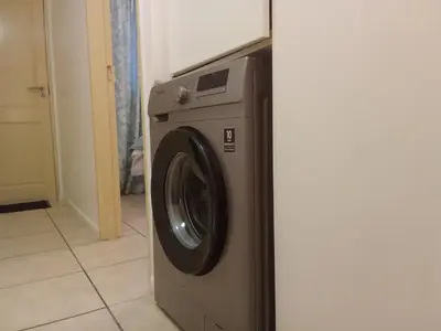 a washing machine is sitting in a room at Klipkop Self-catering Haven in Cravenby