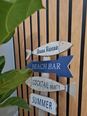 a sign that says beach bar and cocktail party at Spring Tide Beach Flat Child Petfriendly Hot Tub in Bloubergstrand