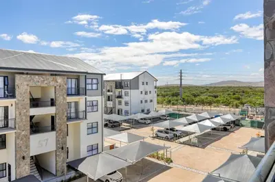 an aerial view of an apartment complex with a parking lot at Joseph's Place Sandown CAPE TOWN in Cape Town