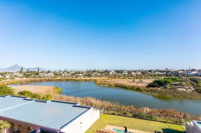 a view of a river from a house at Century on Lake B31 by CTHA in Cape Town