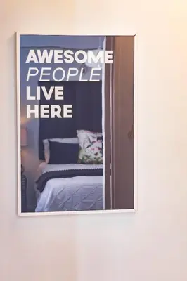 a mirror with a picture of a bed in a room at La Savina On Lake 219 The Island Club in Cape Town