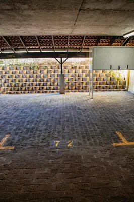 an empty parking lot with a sign in the middle at La Savina On Lake 219 The Island Club in Cape Town