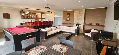 a living room with a pool table and a billiards at C-Onrus in Hermanus