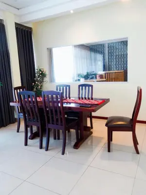 a dining room with a table and chairs at Ngena Sleep and Go Goodwood in Goodwood