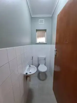a bathroom with a toilet and a sink at Azzure Apartments 6 sleeper Crawford in Cape Town