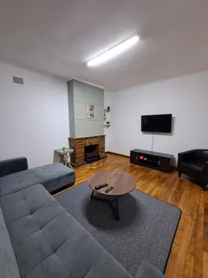 a living room with a couch and a coffee table at Azzure Apartments 6 sleeper Crawford in Cape Town