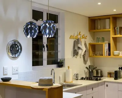 a kitchen with a sink and a window at Arch Window garden apartment in Stellenbosch