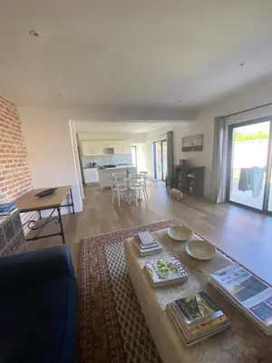 a living room with a table and a living room at Beertjie Bos in Paarl