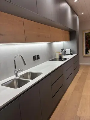 a kitchen with a sink and a counter at Modern living in central town in Stellenbosch