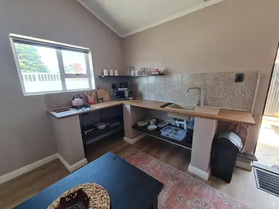 a kitchen with a counter and a sink and a window at LieBling Place in Cape Town