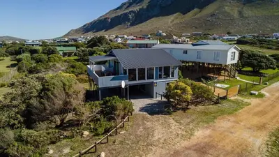 an aerial view of a house on a hill at BluCabana 500m from Main Beach in Bettyʼs Bay